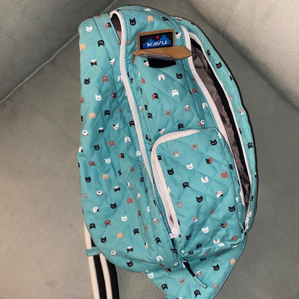 Kavu  Rope Bag, multi-cat patterned with teal/blue background.